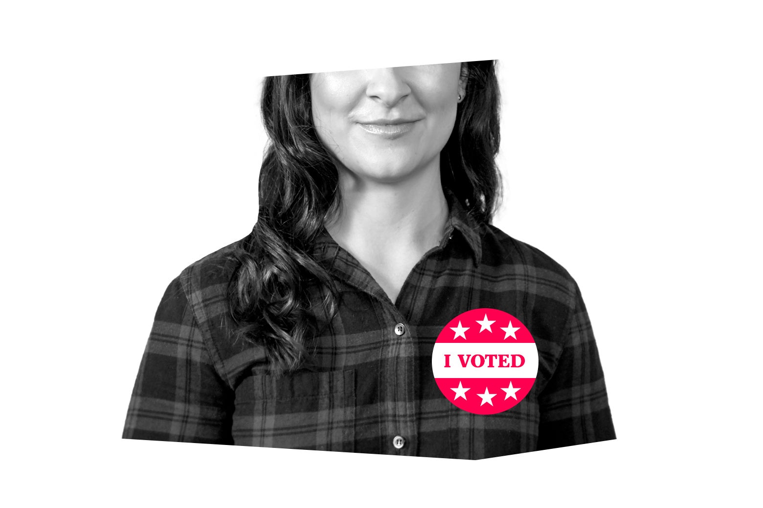 Woman smiling wearing an I Voted sticker on her shirt.