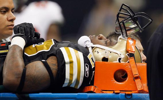 Tracy Porter of the New Orleans Saints is carried off the field on a stretcher.