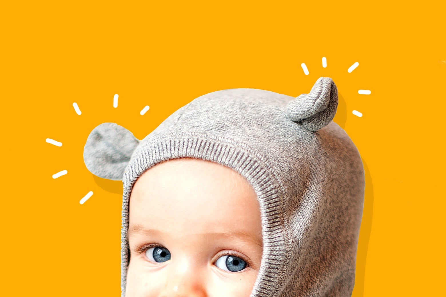 Baby wearing a cute animal-ear hood.
