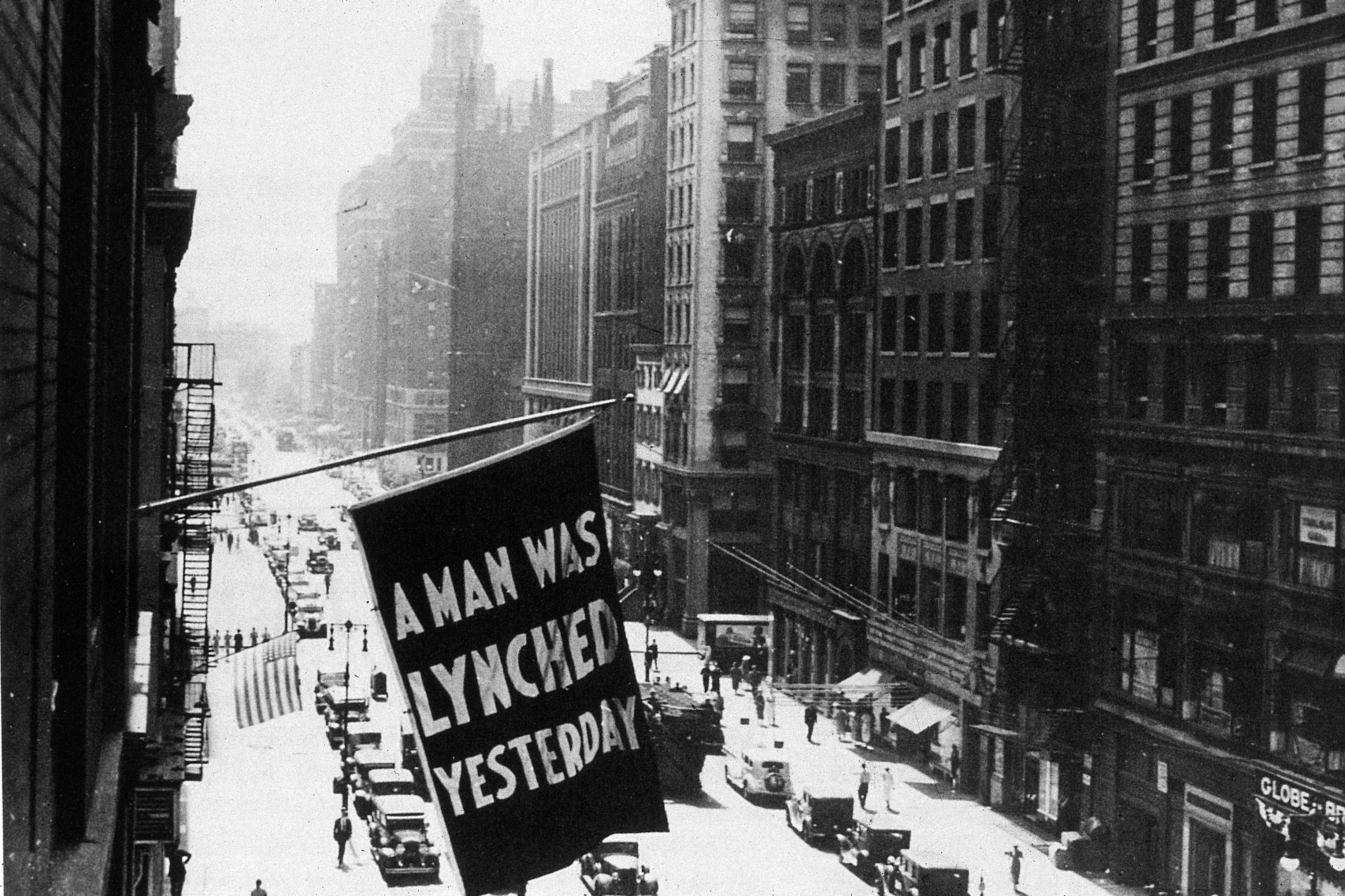 A flag hanging outside the headquarters of the NAACP, bearing the words "A Man Was Lynched Yesterday."