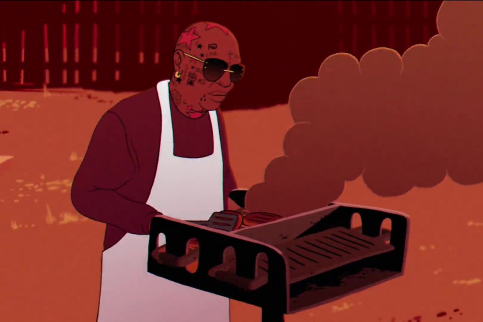 Rapper and record executive Birdman, burning things on a grill.