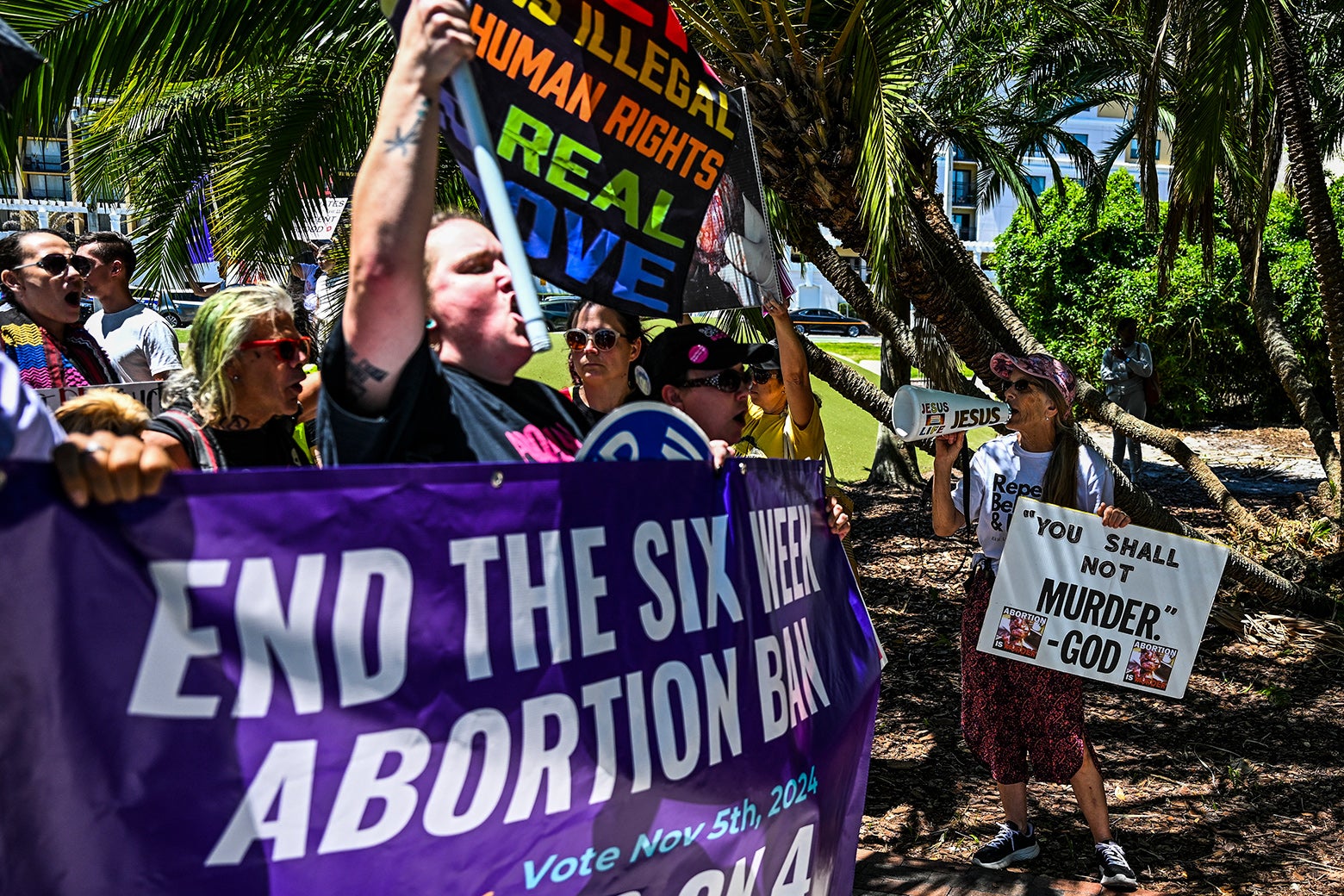 A group of anti-abortion activists protest near the "Rally for Our Freedom" to protect abortion rights in Orlando.