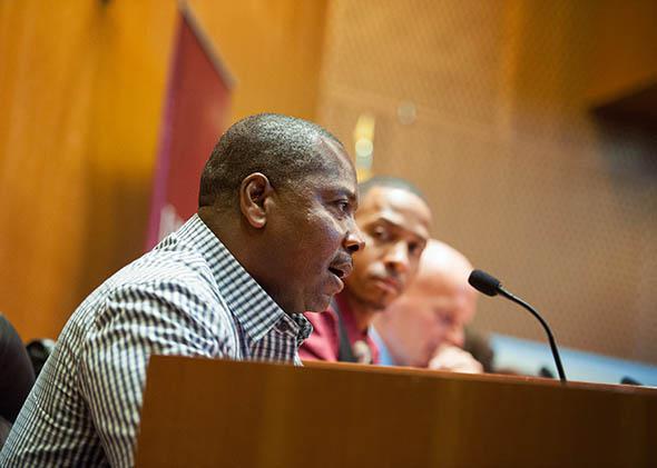 Kash Register speaking on a panel of exonerees at an Innocence Day event at Loyola Law School in October 2014.
