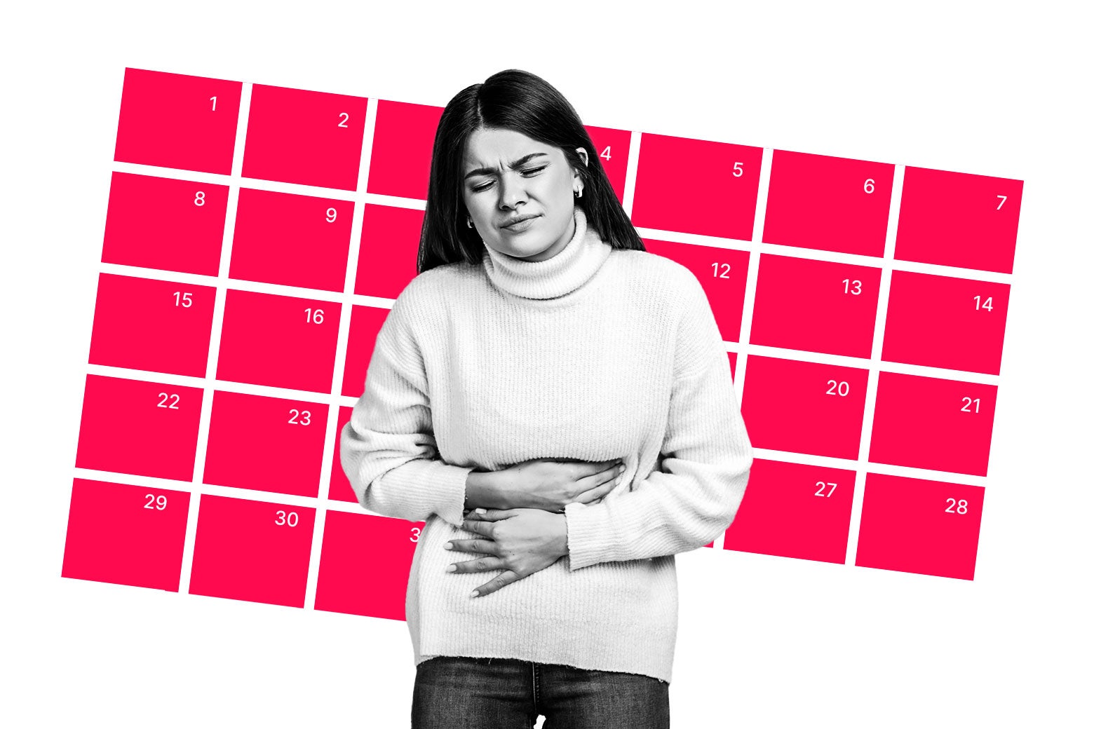 Woman holding her stomach in front of a monthly calendar.