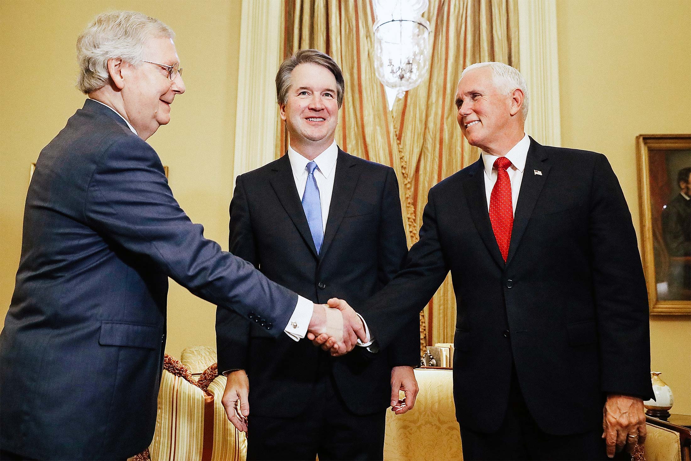 Judge Brett Kavanaugh between Senate Majority Leader Mitch McConnell and Vice President Mike Pence before a meeting at the U.S. Capitol on Tuesday.
