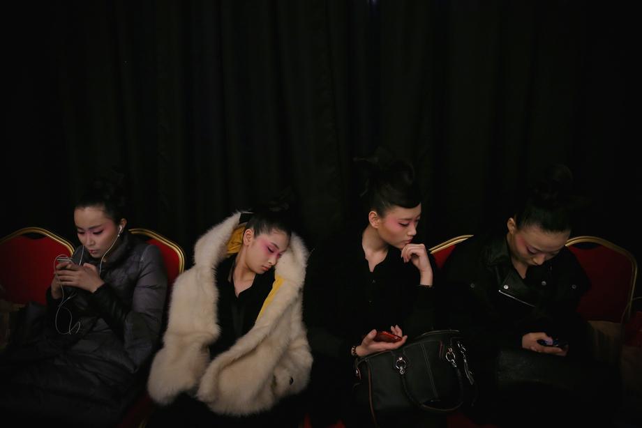 Models rest before Minzu University of China Collection on the fourth day of Mercedes-Benz China Fashion Week Autumn/Winter 2013/2014 at Banquet Hall of Beijing Hotel on March 27, 2013 in Beijing.