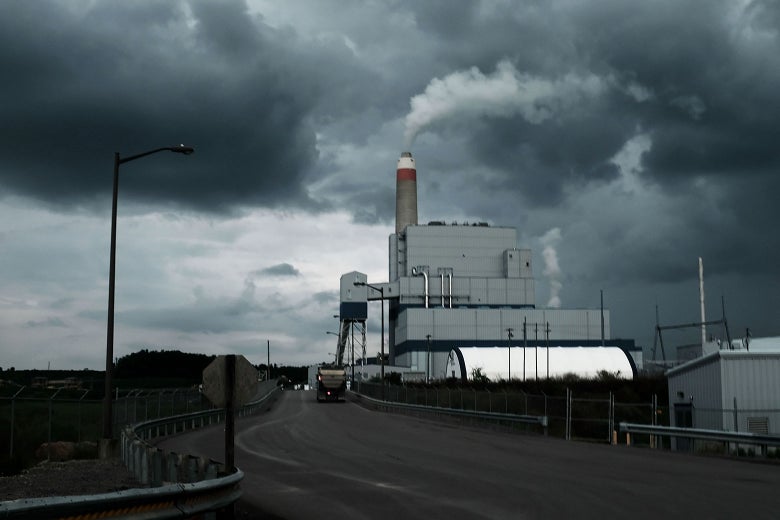A power plant besides a road.