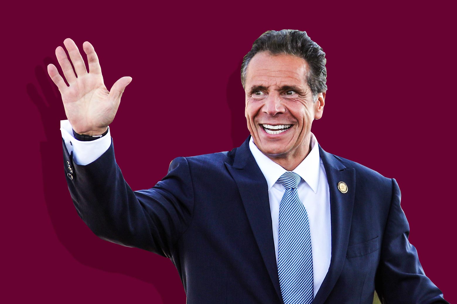 Andrew Cuomo smiles and waves.