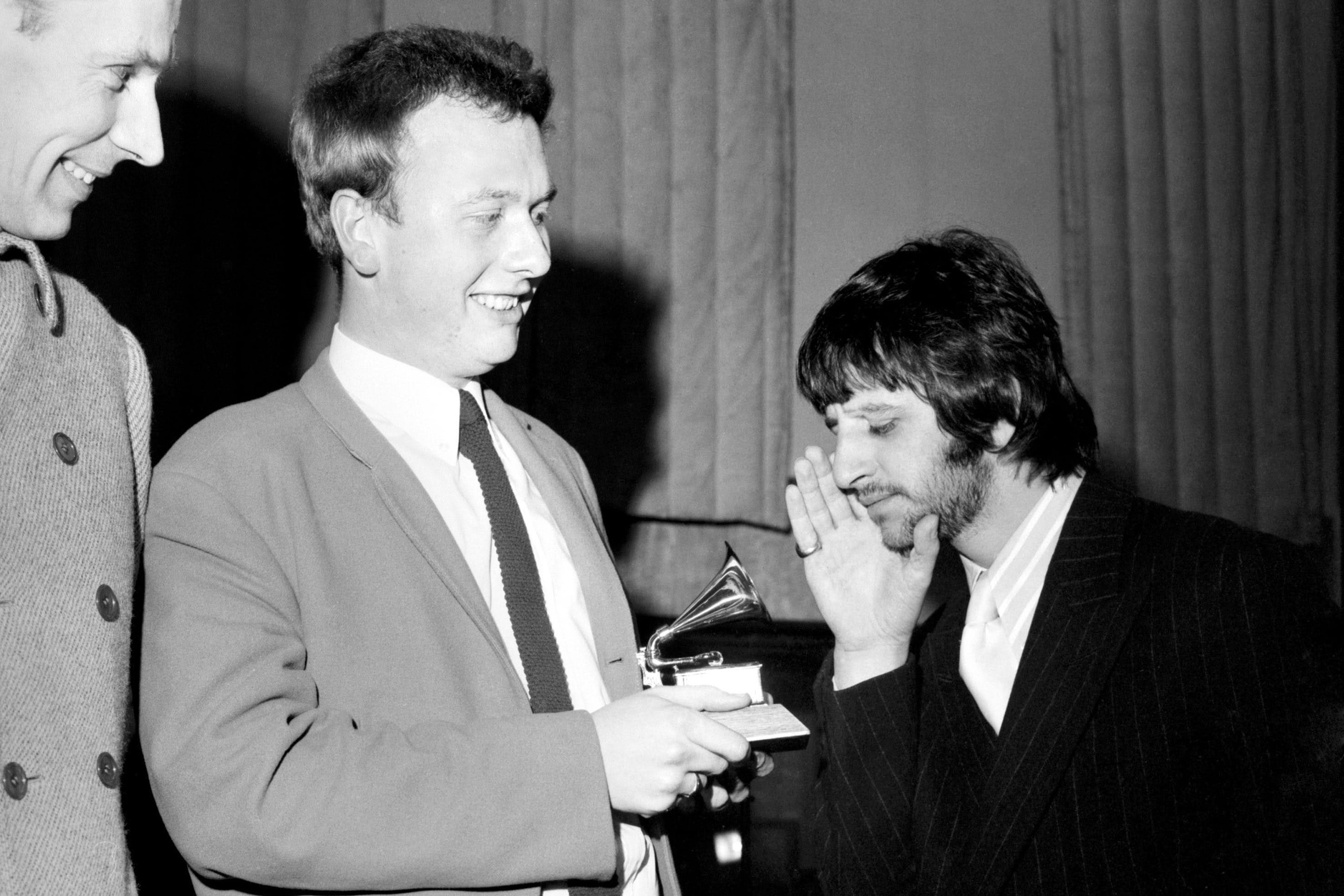 Geoff Emerick, Ringo Starr, and Emerick’s Grammy for Sgt. Pepper’s Lonely Hearts Club Band in 1968.