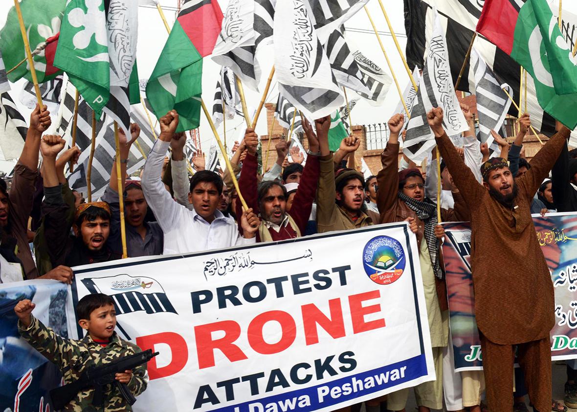 Supporters of Defense of Pakistan Council, a coalition of religious and political parties, chant anti-US slogans during a protest against the US drone strikes in the Pakistani tribal region, in Peshawar on November 10, 2013.
