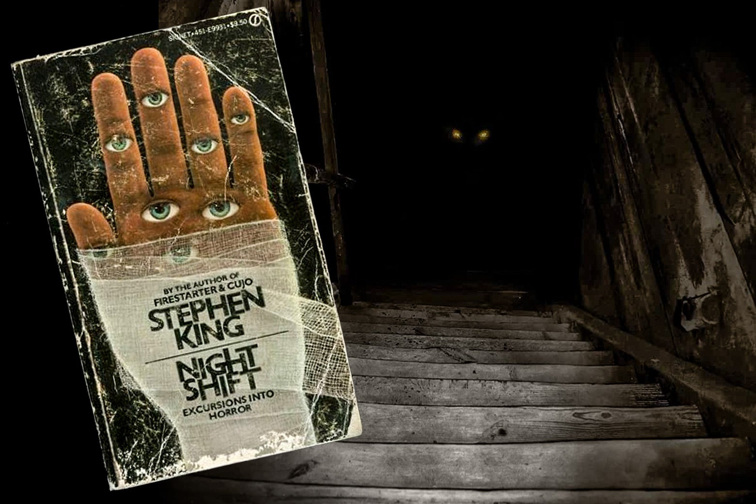 A well-worn copy of Night Shift is held at the top of some dark and cobwebby cellar stairs. 