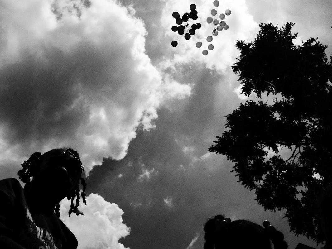 Balloons are released in memory of Siretha White and Starkeisha Reed during a block party on South Marshfield Avenue and West 69th Street. Englewood, Chicago, 2009.