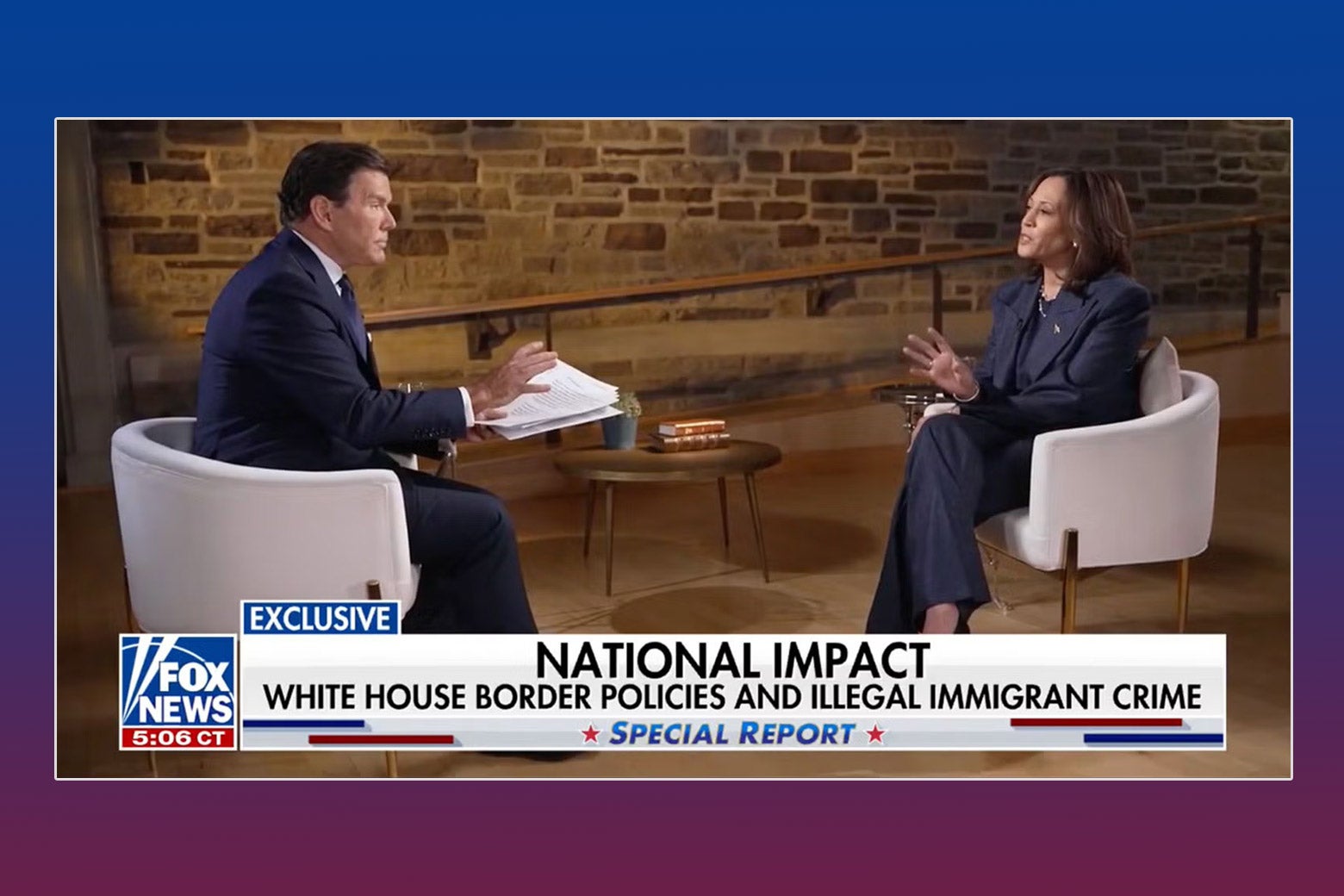 A man (Bret Baier) and a woman (Kamala Harris) sit facing each other, in white chairs.