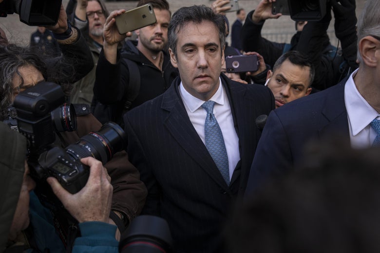 Michael Cohen surrounded by cameras and reporters