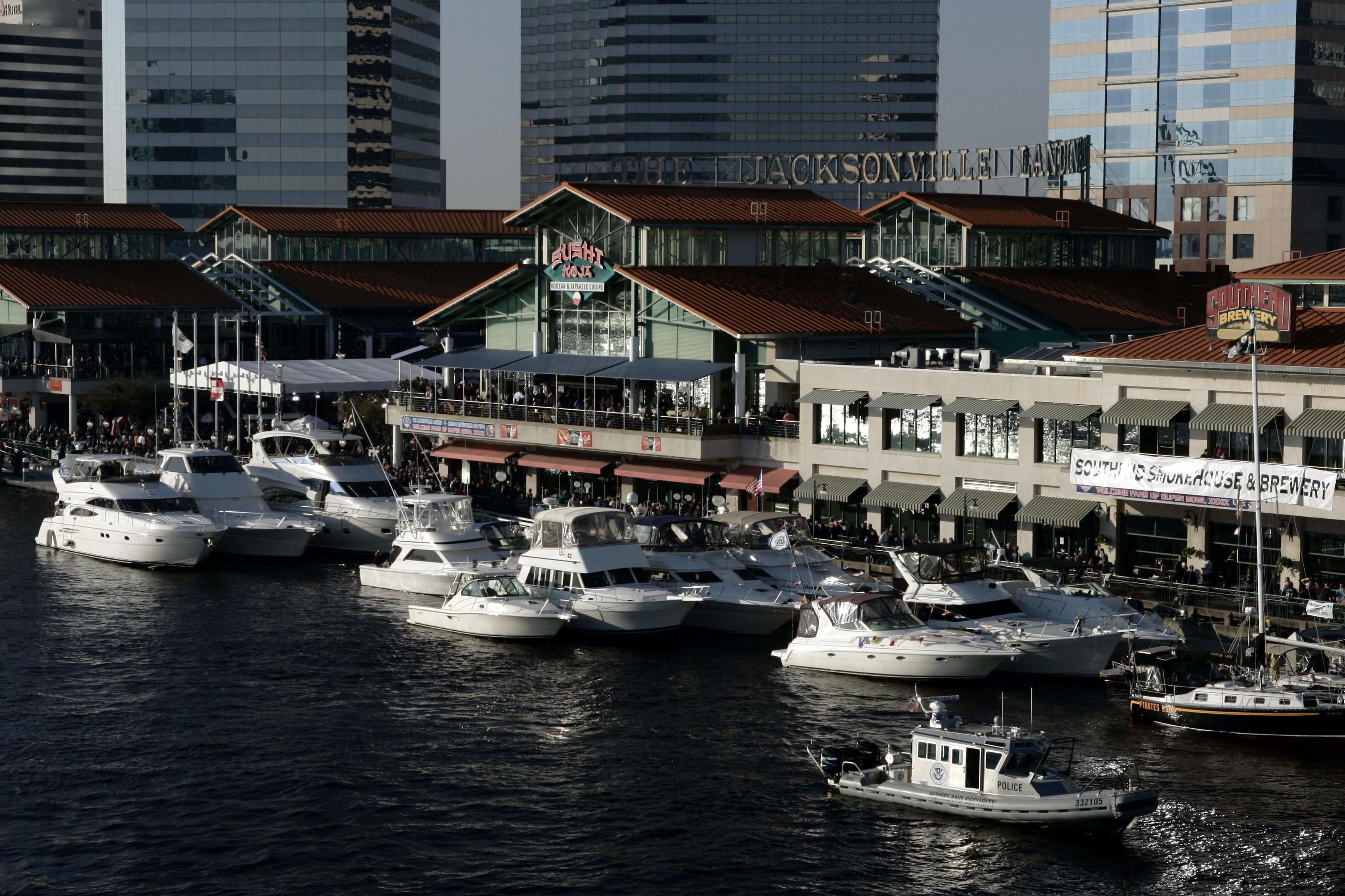 The Jacksonville Landing complex with boats in front of it.