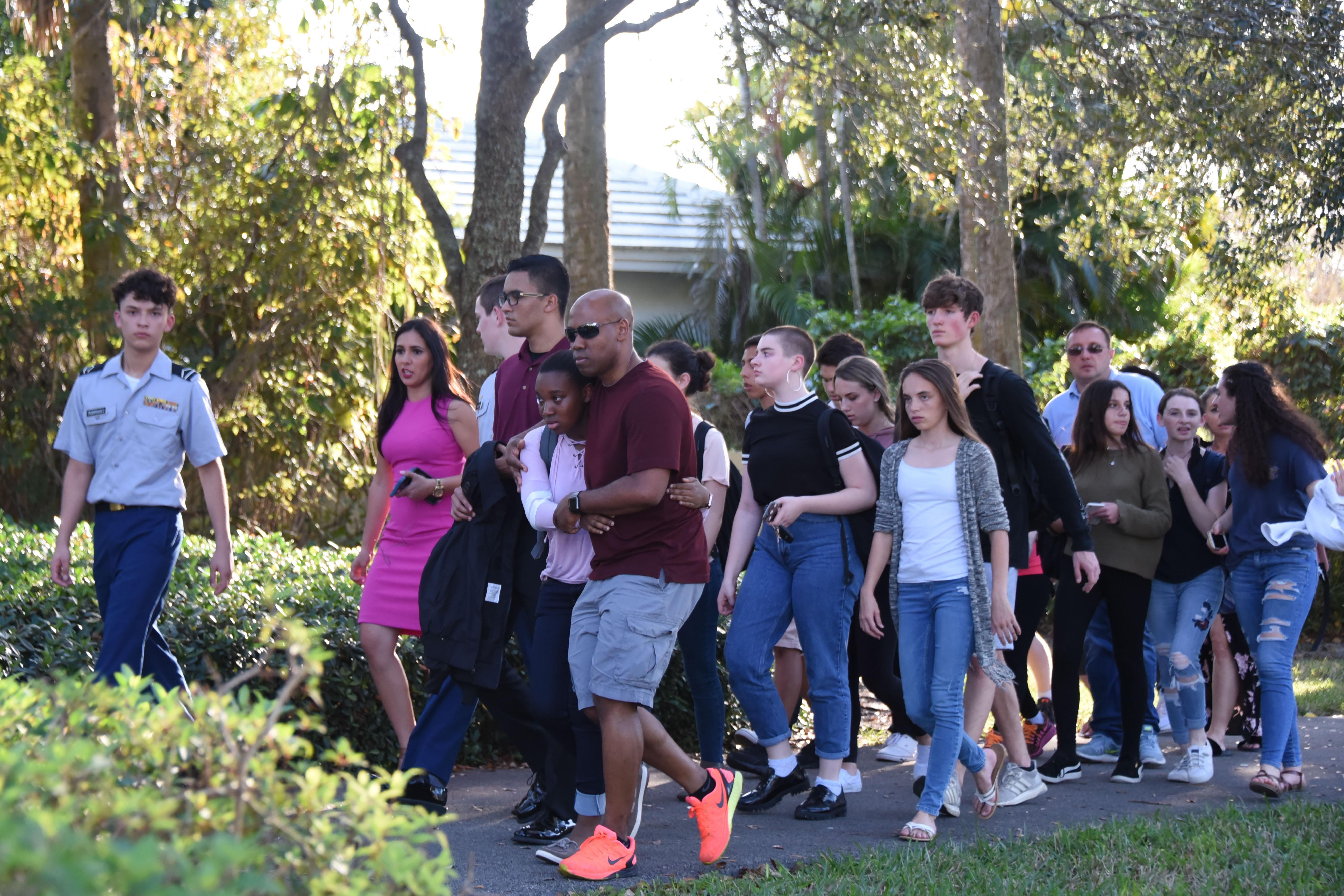 Students react following a shooting at Marjory Stoneman Douglas High School in Parkland, Florida.