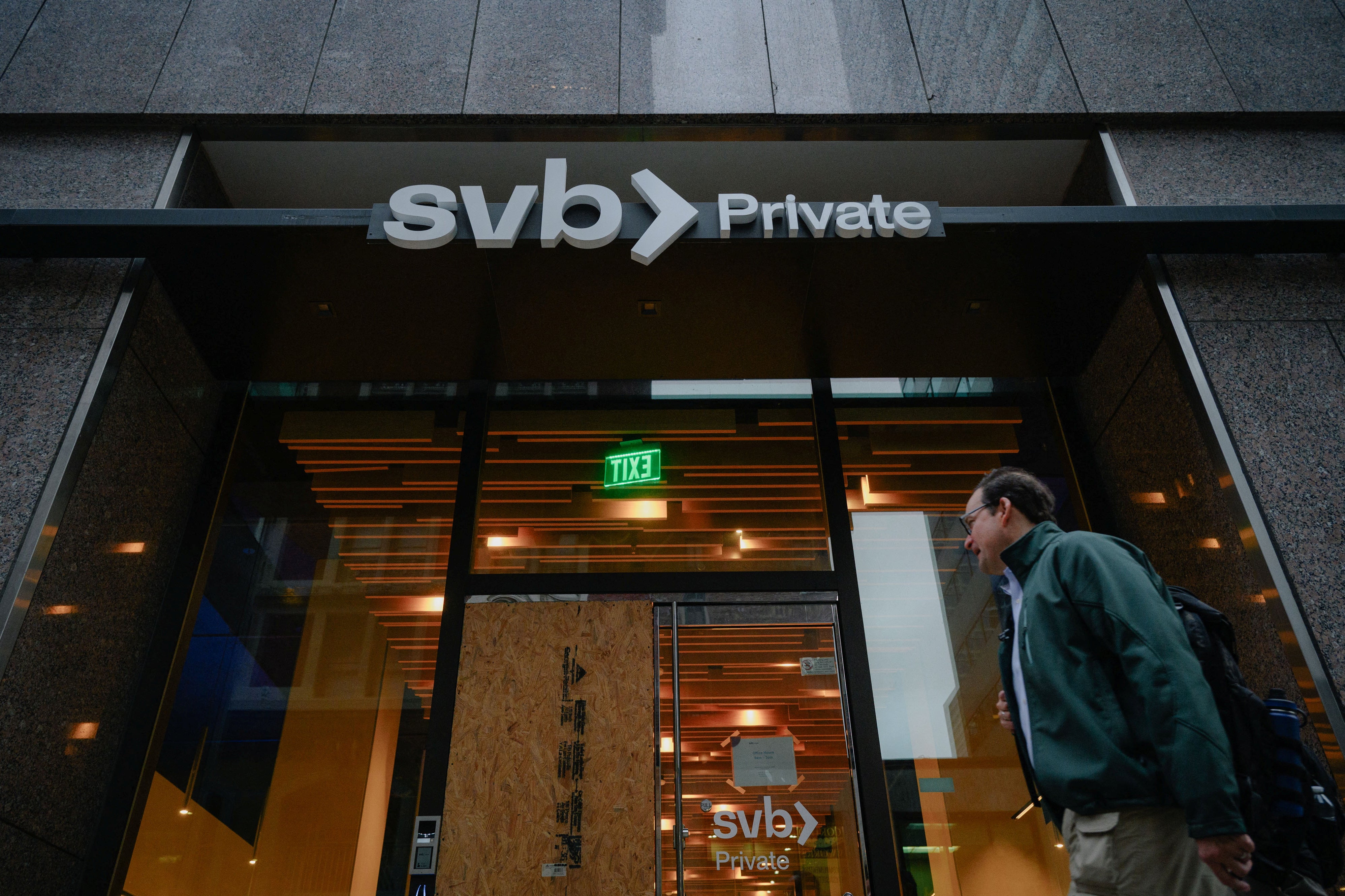 A man walks by an SVB branch in San Francisco.