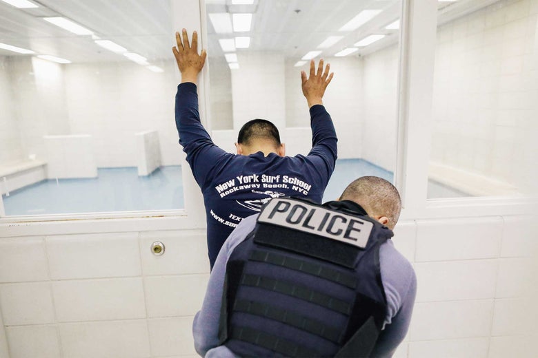 An undocumented immigrant is frisked by an Immigration and Customs Enforcement (ICE), officer after arriving to an ICE processing center on April 11, 2018 at the U.S. Federal Building in lower Manhattan, New York City.