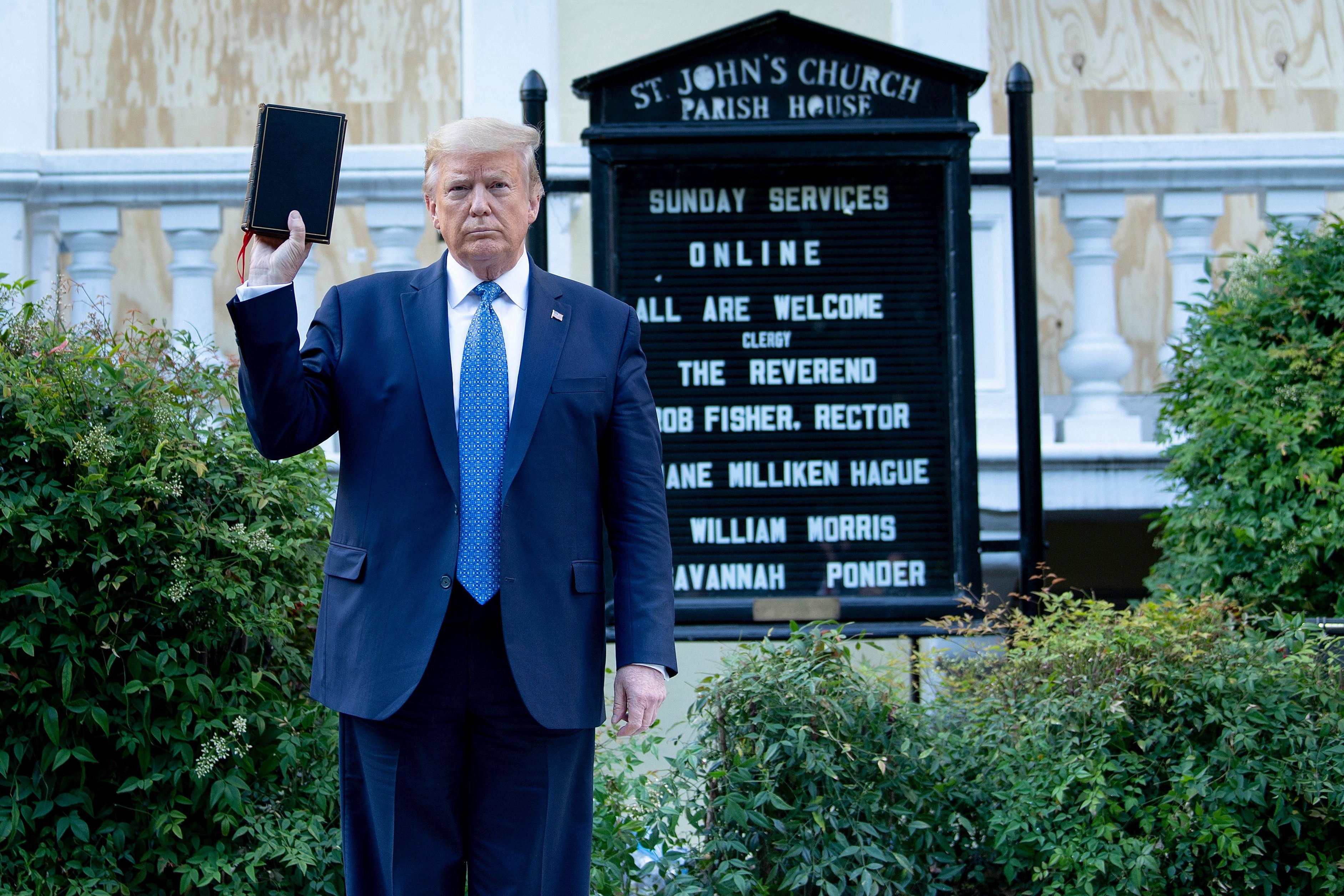 Then-President Donald Trump holds a Bible while visiting St. John's Church across from the White House after the area was cleared of people protesting the death of George Floyd June 1, 2020, in Washington, D.C.The White House announced that the president would make remarks imminently after he has been criticized for not publicly addressing in the crisis in recent days. (Photo by Brendan Smialowski / AFP) (Photo by BRENDAN SMIALOWSKI/AFP via Getty Images)