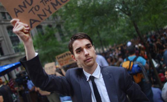 NEW YORK, NY - SEPTEMBER 30: Luther Green (C) from Booklyn, NY, joins other demonstrators opposed to corporate profits on Wall Street gathered at Zuccotti Park in the Financial District on September 30, 2011 New York City. Hundreds of activists affiliated with the 'Occupy Wall Street' demonstrations have begun living in Zuccotti Park in the Financial District near Wall Street. The activists will march against police brutality later in the day. (Photo by Mario Tama/Getty Images)