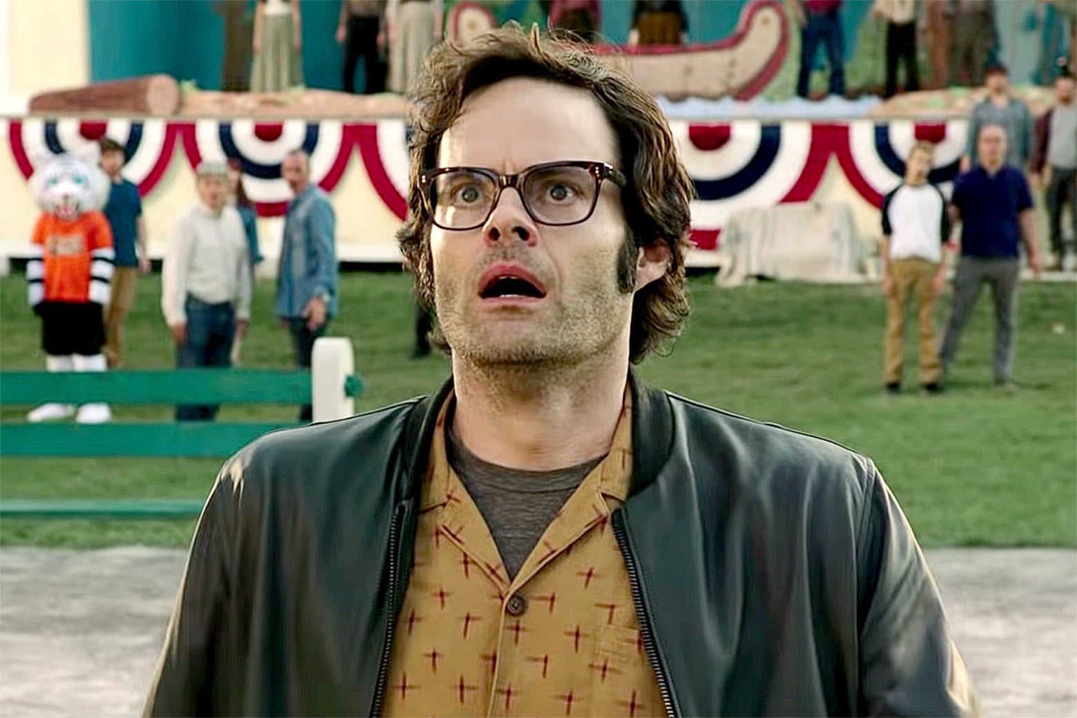 Bill Hader’s looks up as if in surprise/horror.