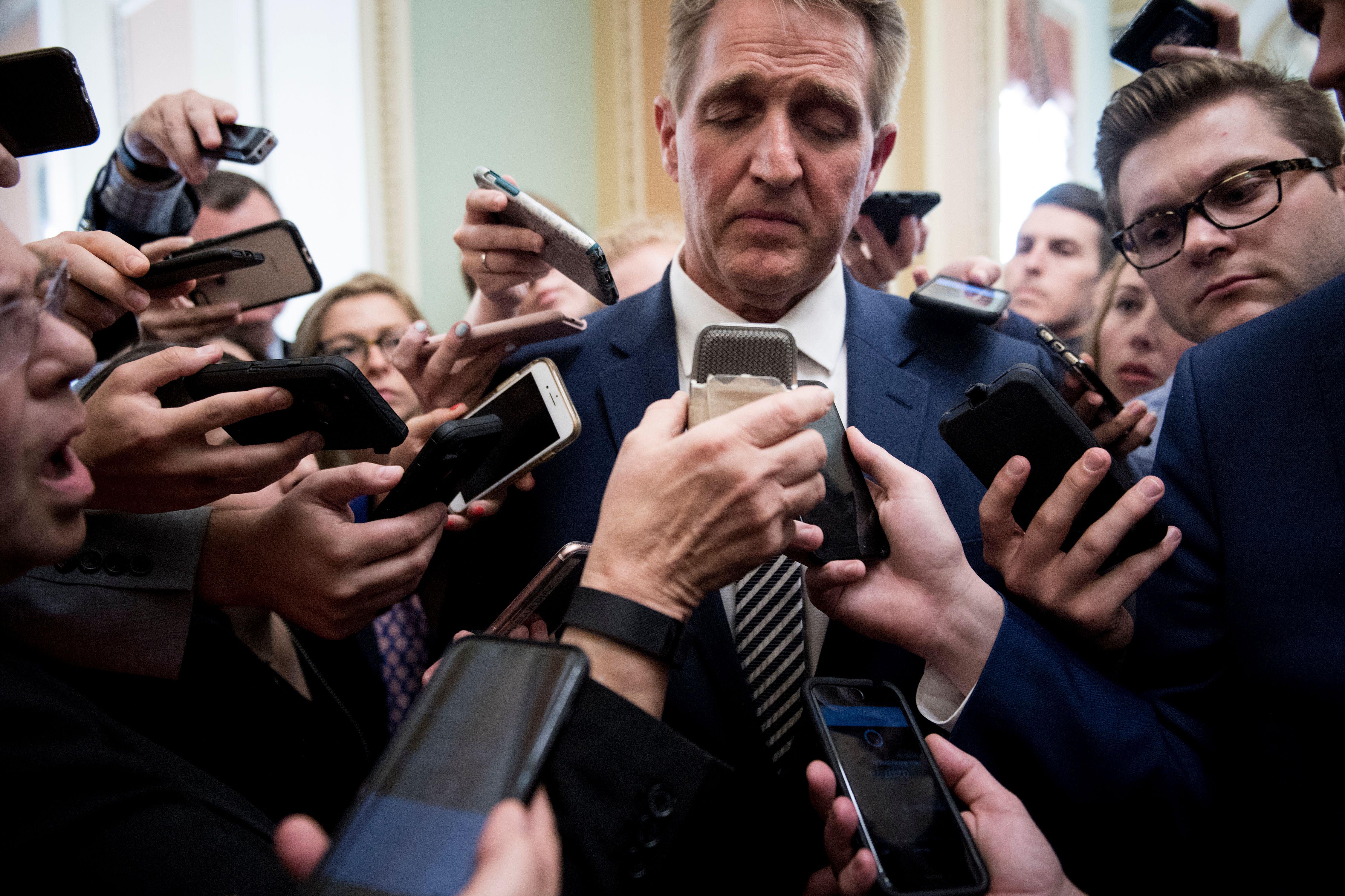 Senator Jeff Flake speaks with reporters after a meeting with Senate Majority Leader Senator Mitch McConnell about the Judge Brett Kavanaugh nomination on Capitol Hill on September 28, 2018 in Washington, DC. 