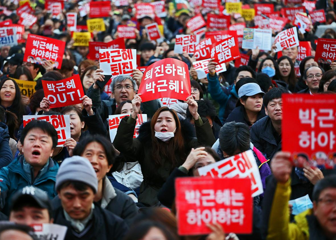 Thousands of South Koreans take to the streets in the city center to demand President Park Geun-Hye to step down on November 12, 2016 in Seoul, South Korea. 
