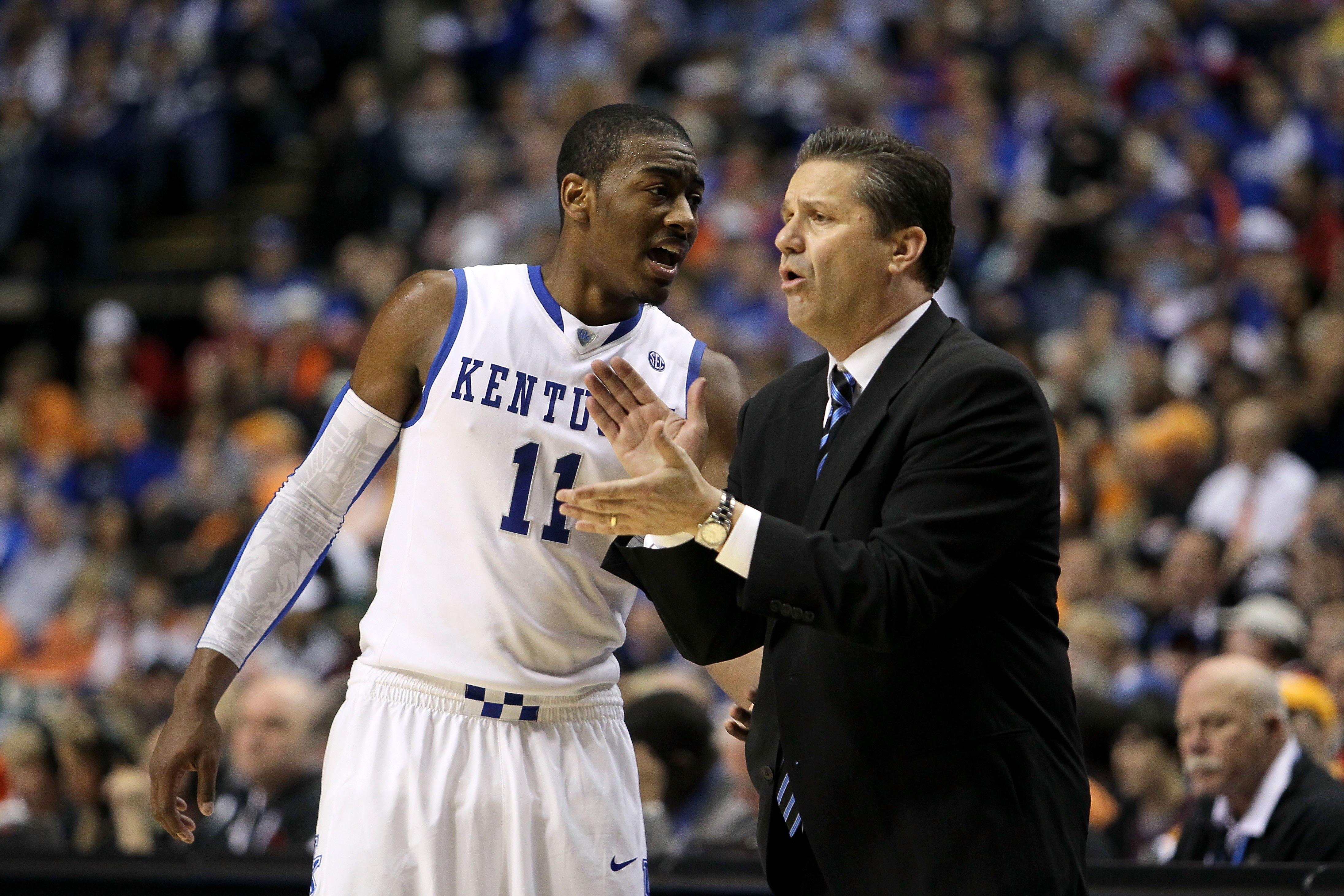 Wall and Calipari talk on the sidelines