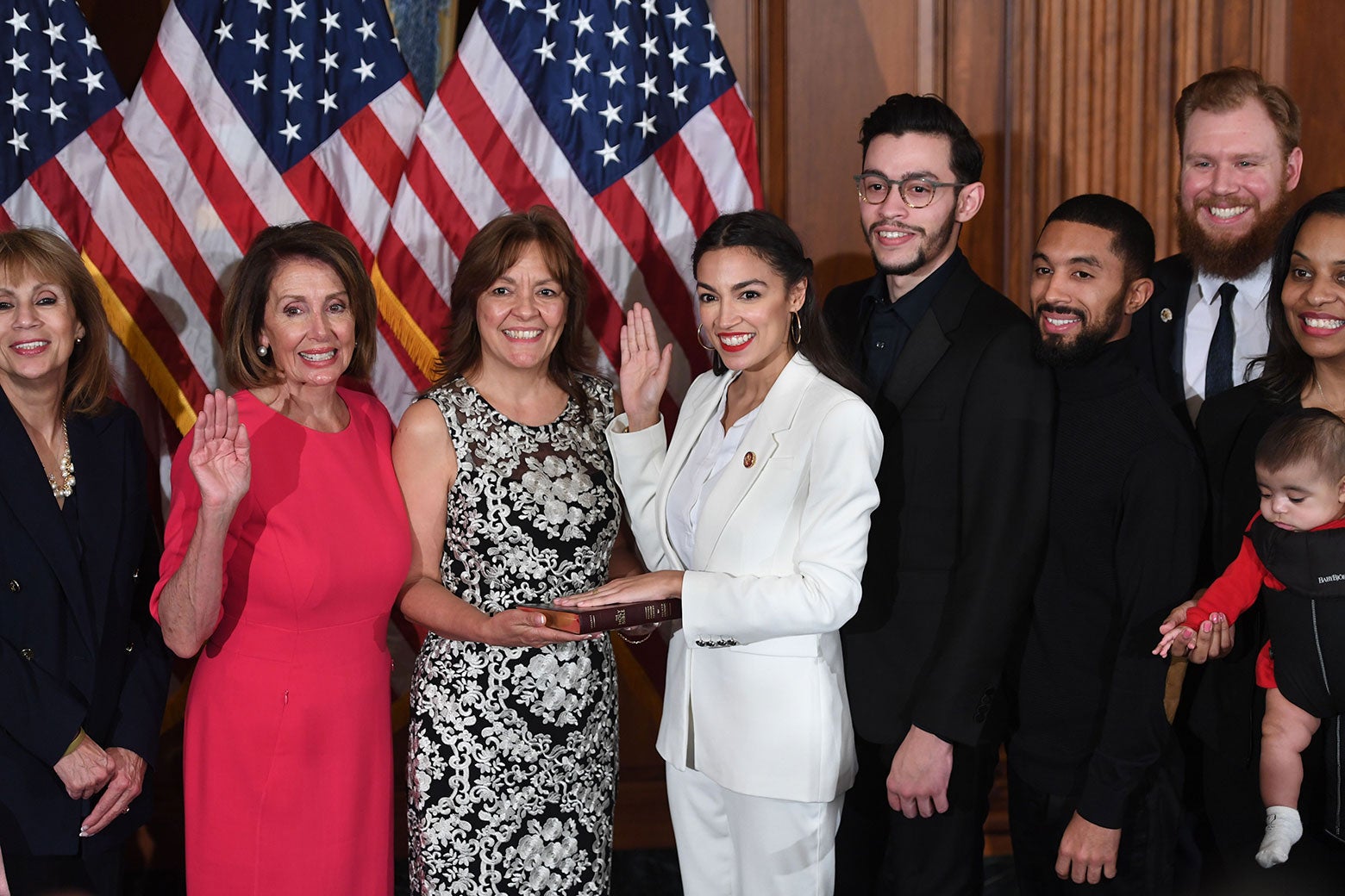 Speaker of the House Nancy Pelosi performs a ceremonial swearing-in for New York Rep. Alexandria Ocasio-Cortez.