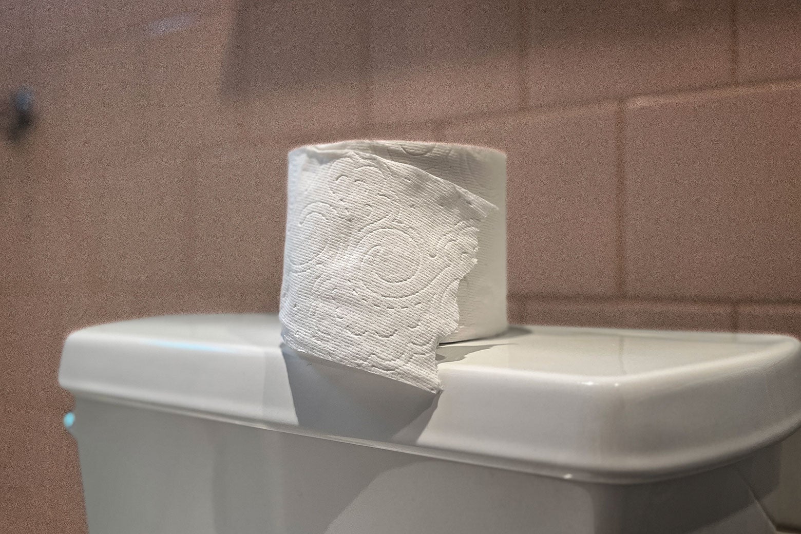 A roll of toilet paper that has the new wavy edge.
