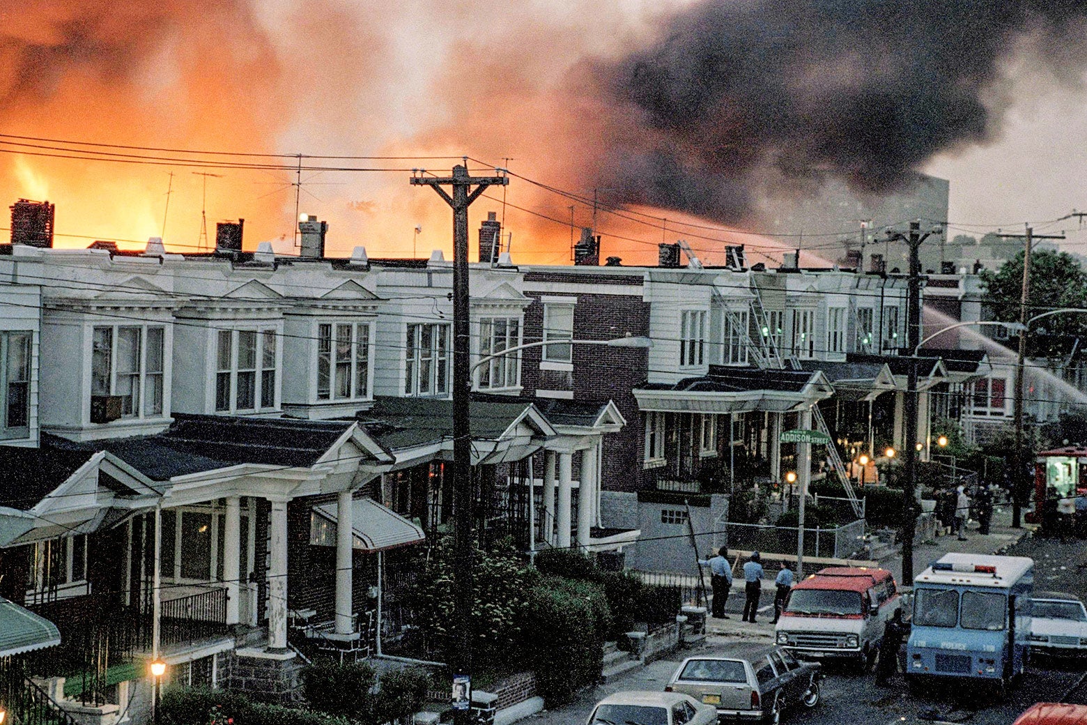 Row houses burn in Philadelphia after police dropped a bomb on MOVE headquarters on May 13, 1985.