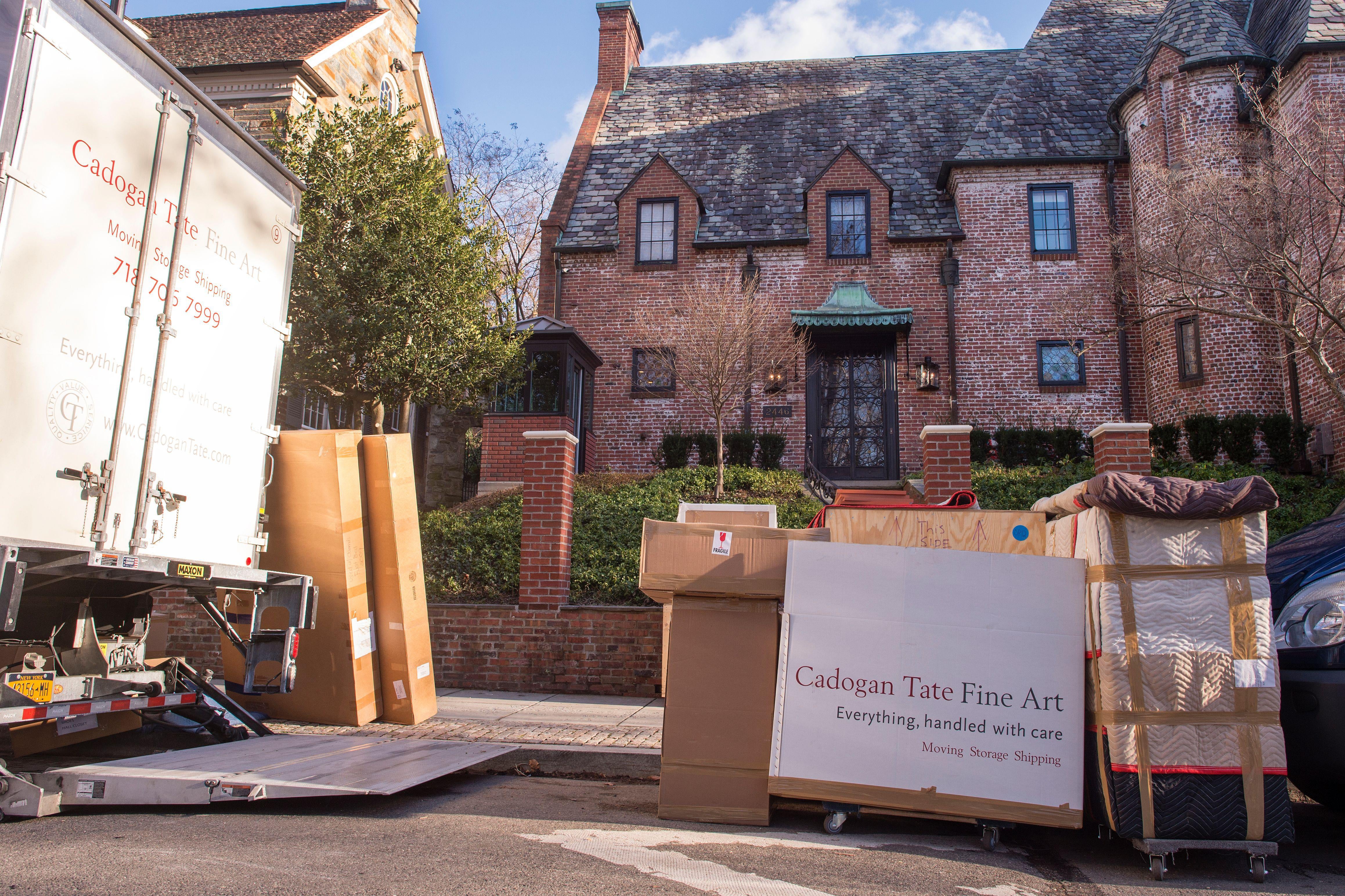 A moving truck is seen outside the new home of President Barack Obama in the Kalorama neighborhood of Washington, D.C. on January 18, 2017.