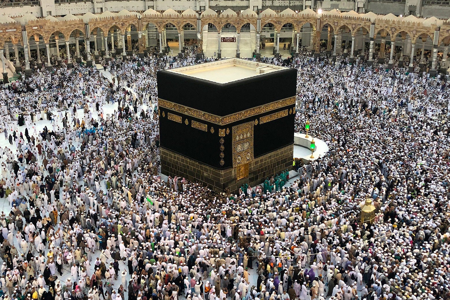 Muslim worshippers pray and circumambulate around the Kaaba.