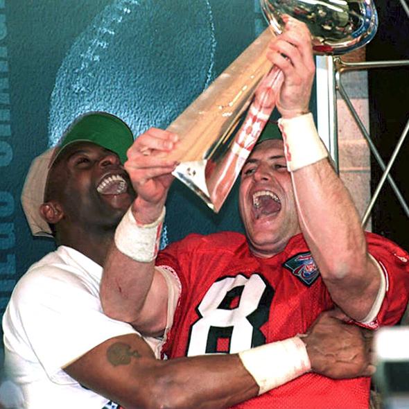San Francisco 49ers quarterback Steve Young (R) and teammate Jerry Rice (L)