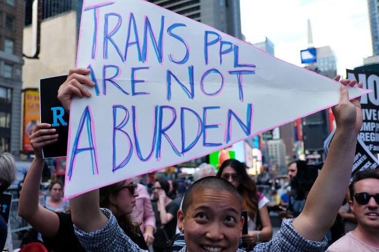 Protesters demonstrate against President Donald Trump's plan to ban open transgender military service.