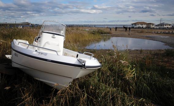 A damaged boat is shown in the wake of superstorm Sandy, Oct. 31, 2012, in Toms River, N.J.