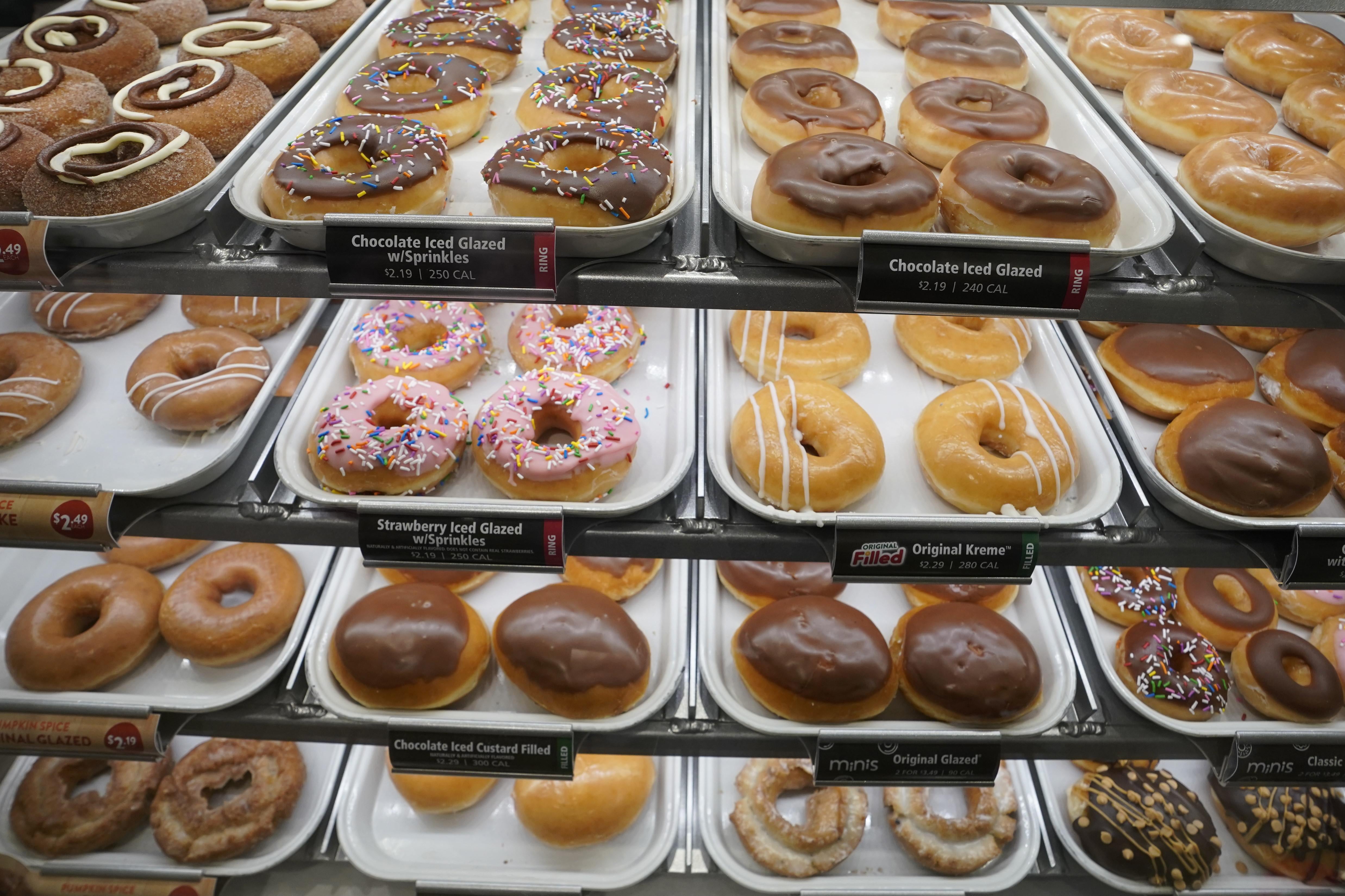 Rows of doughnuts on display.