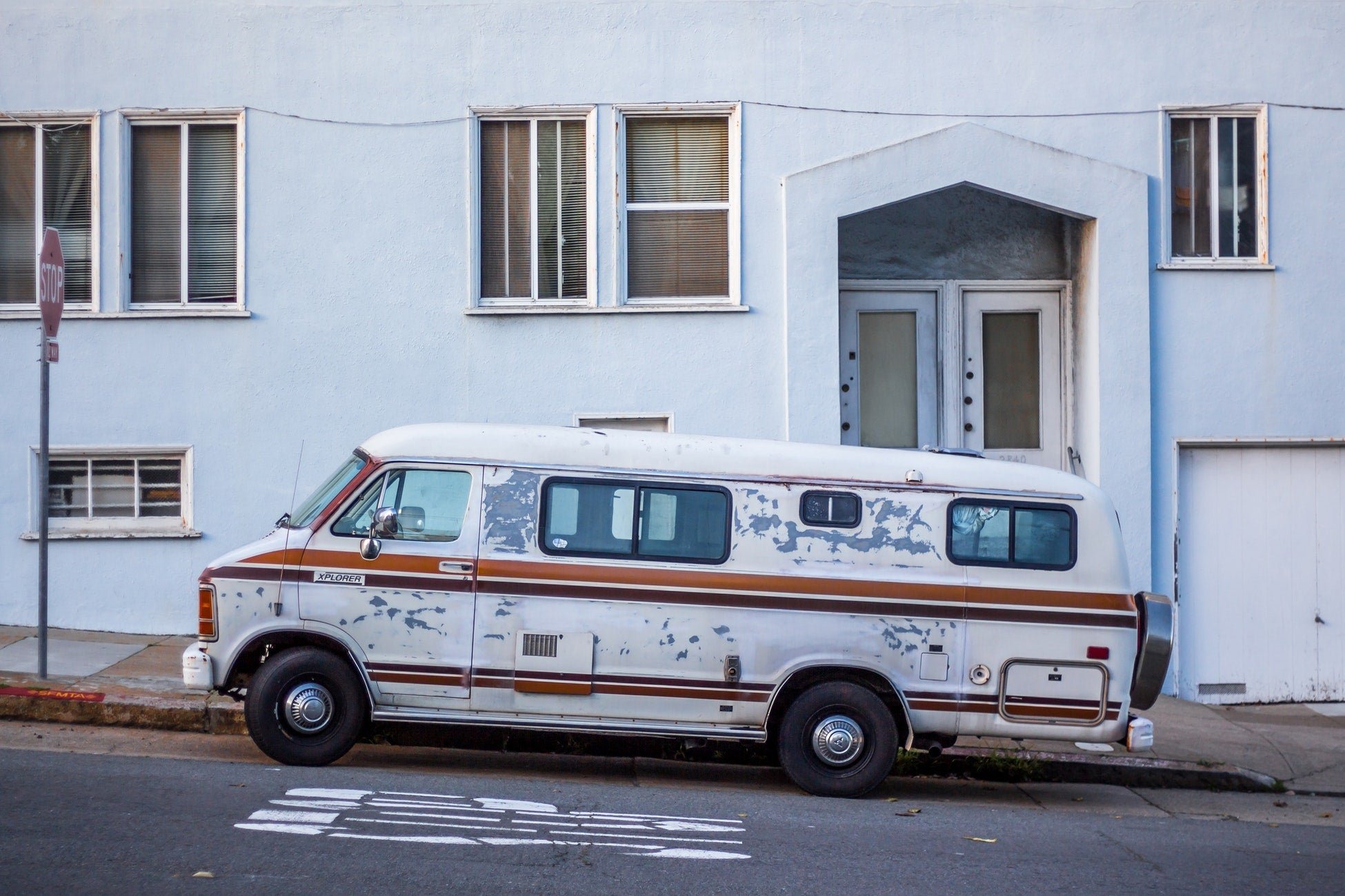A van is parked in front of a building in San Francisco.