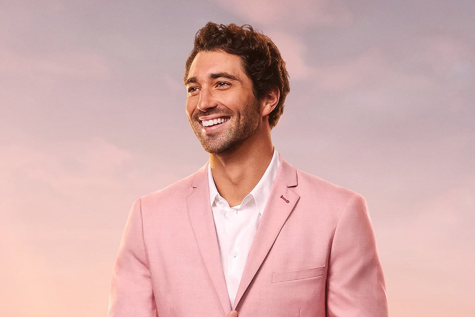 Joey Graziadei from The Bachelor 2024 in a pink suit. 
