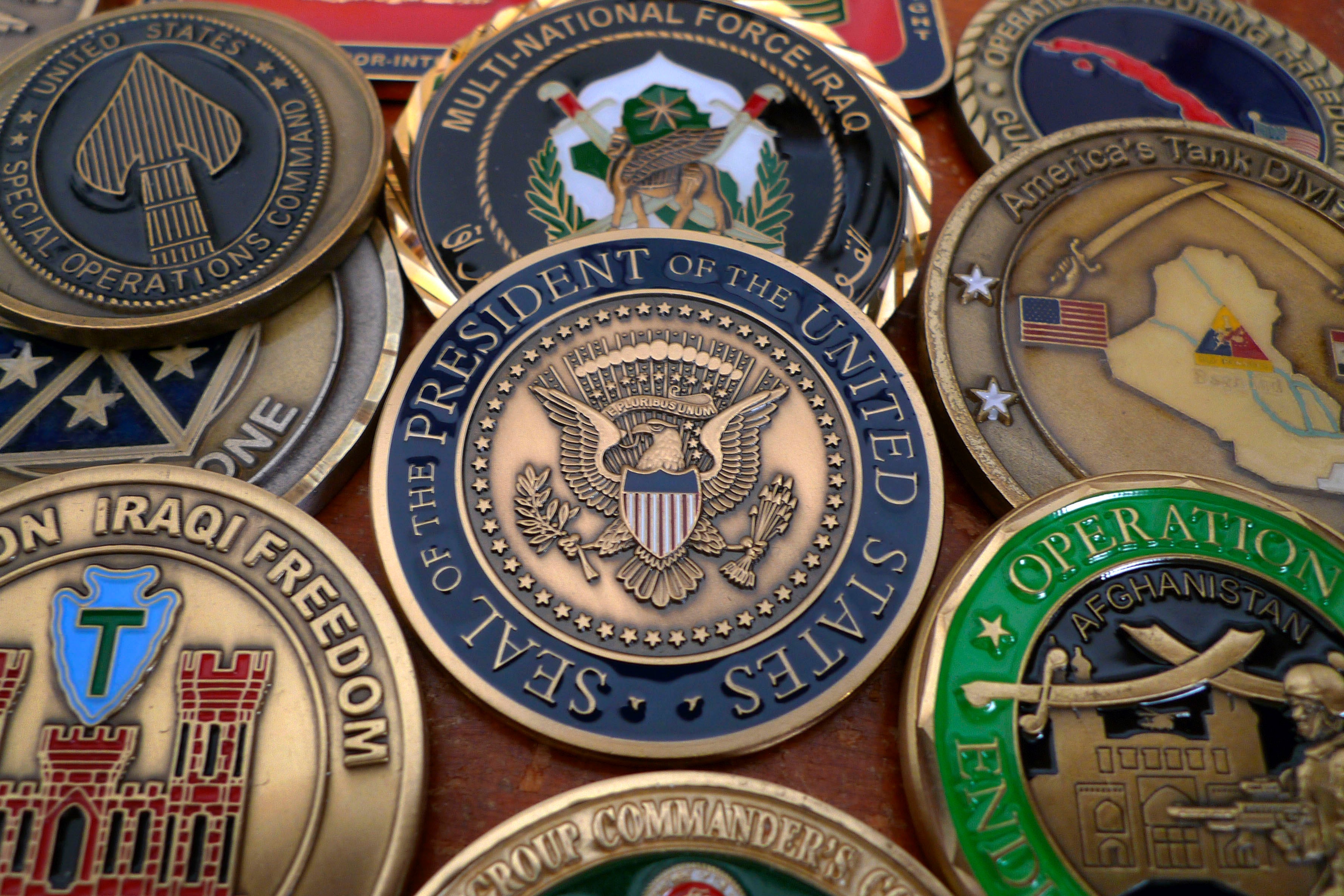 President Barack Obama coin is seen as part of the military challenge coin collection in Fairfax, Virginia September 5, 2010.  