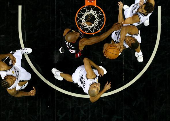 Boris Diaw of the San Antonio Spurs goes to the basket against Ray Allen of the Miami Heat during game five of the 2014 NBA Finals at the AT&T Center on June 15, 2014, in San Antonio