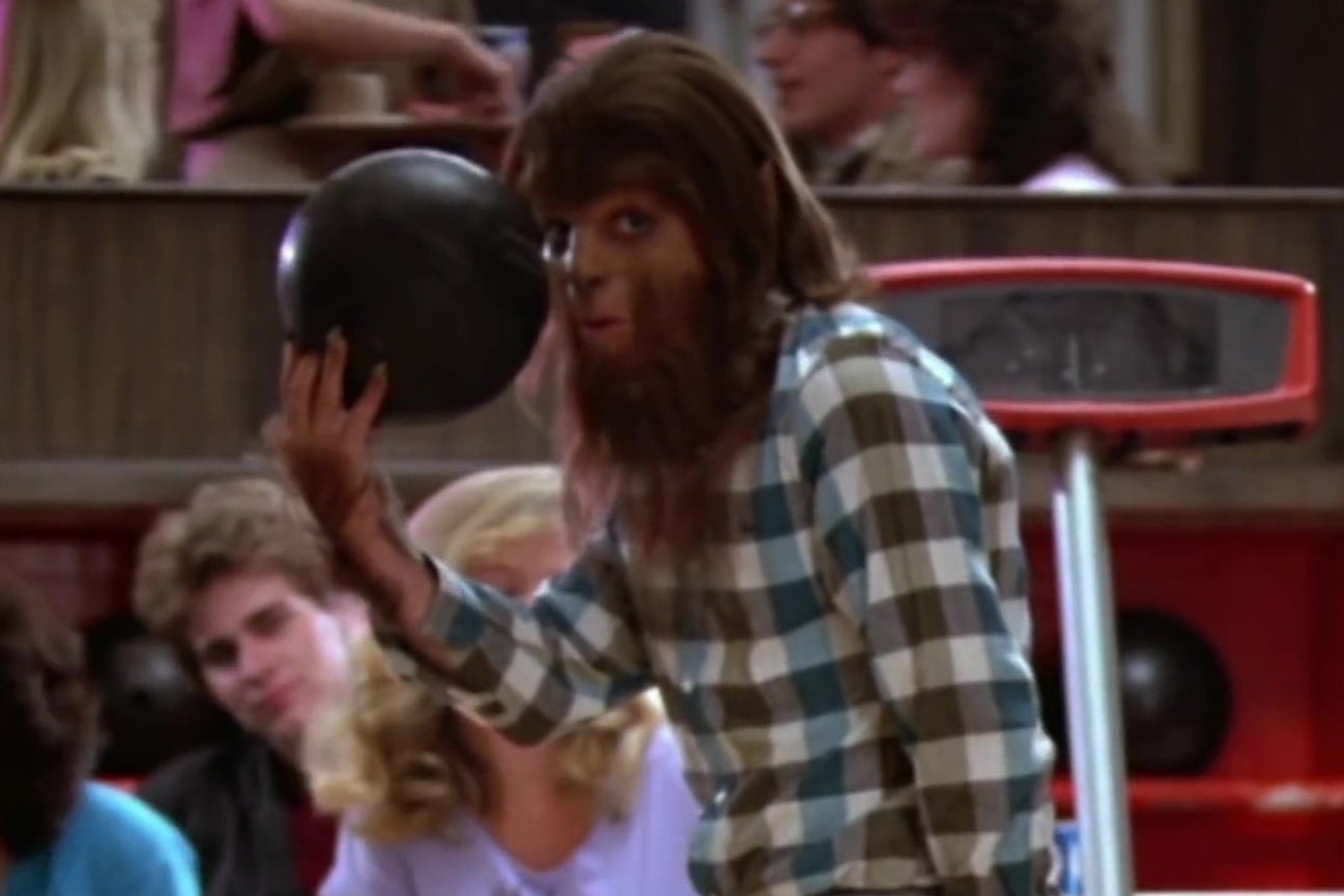 In a still from Teen Wolf, Michael J. Fox, dressed as a werewolf, prepares to bowl.