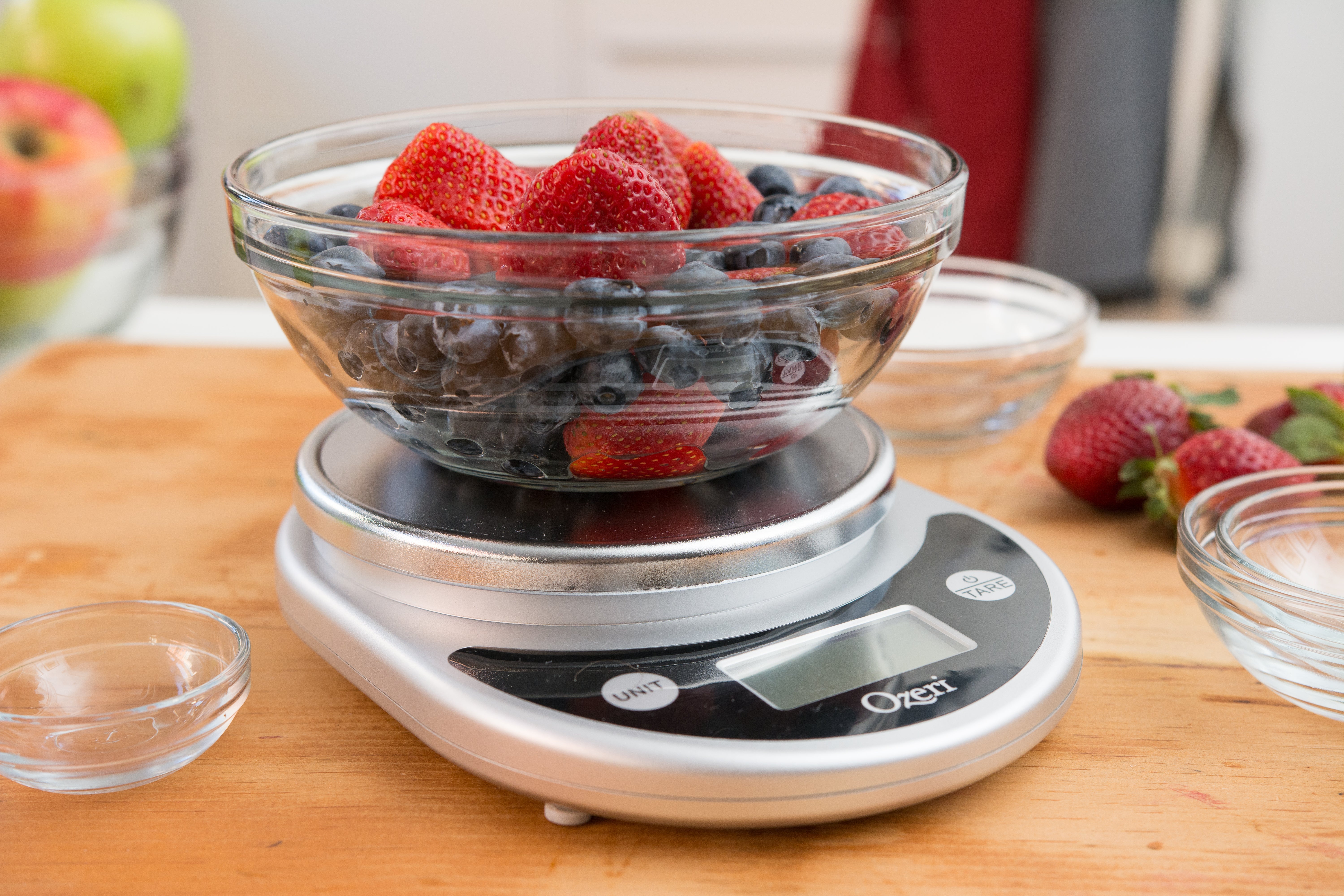 Bowl of fruit on the kitchen scale.