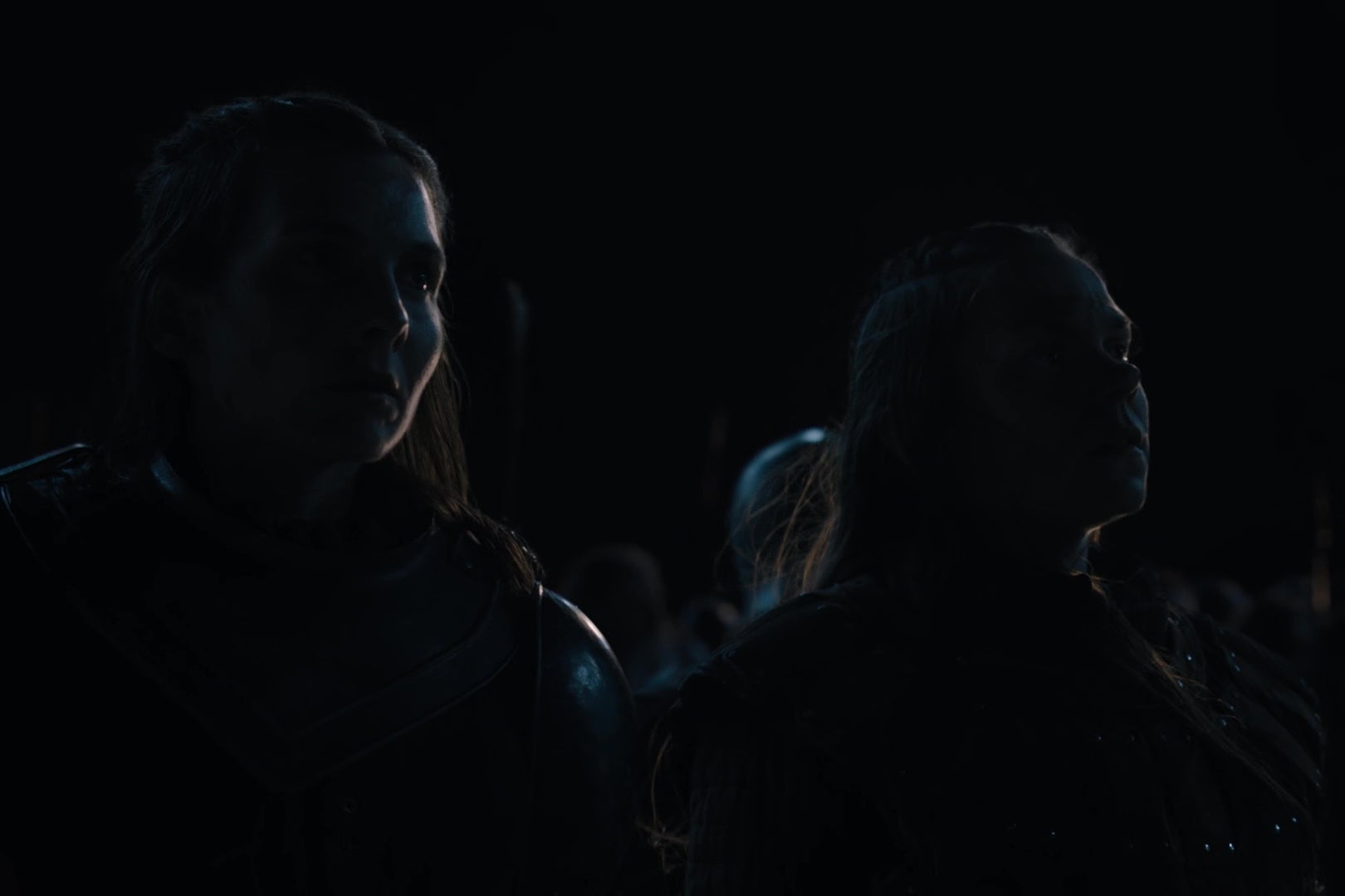 Two human Game of Thrones characters, staring out into darkness.