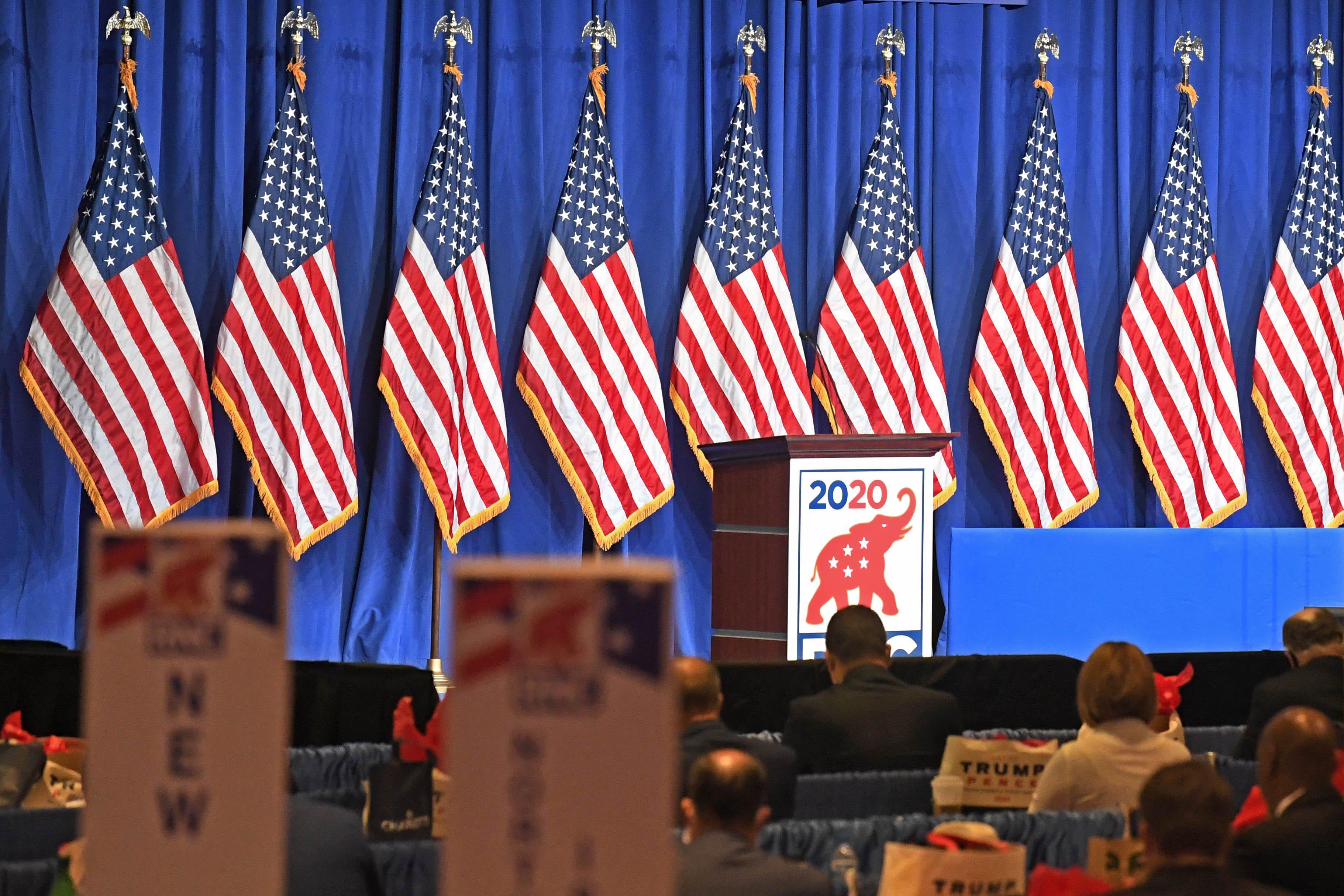 RNC Chairwoman Ronna McDaniel speaks behind a podium. 