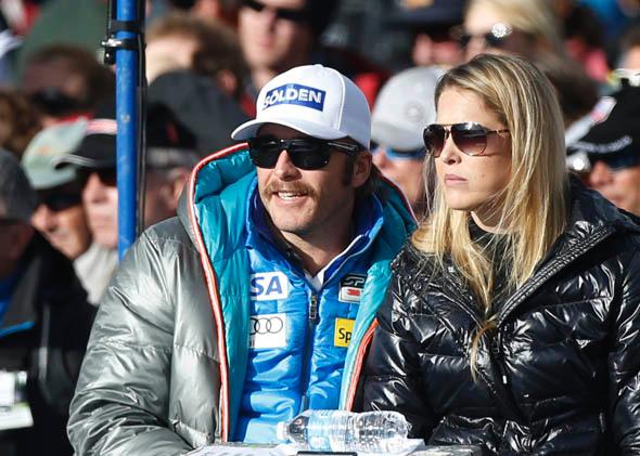 Bode Miller, U.S. alpine World Cup ski racer, watches the men's World Cup downhill ski race with his wife Morgan Beck in Beaver Creek, Colorado November 30, 2012. 