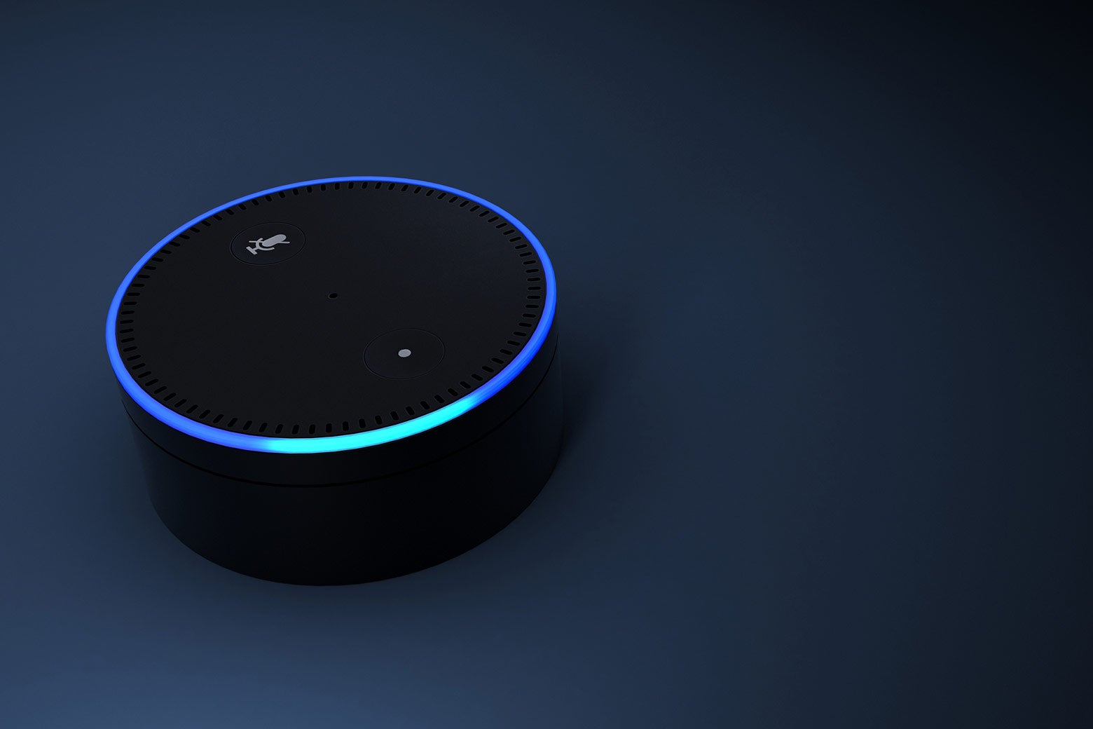 An Echo Dot's ring is lit up, indicating that it's listening.