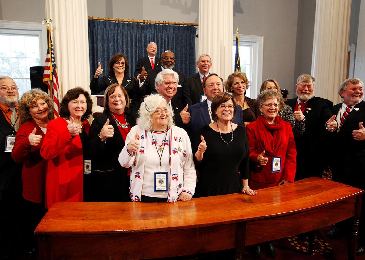 North Carolina's Electoral College representatives give the thumbs up sign after they all affirmed their votes for U.S. President-elect Donald Trump in the State Capitol building in Raleigh, North Carolina, U.S., December 19, 2016.    