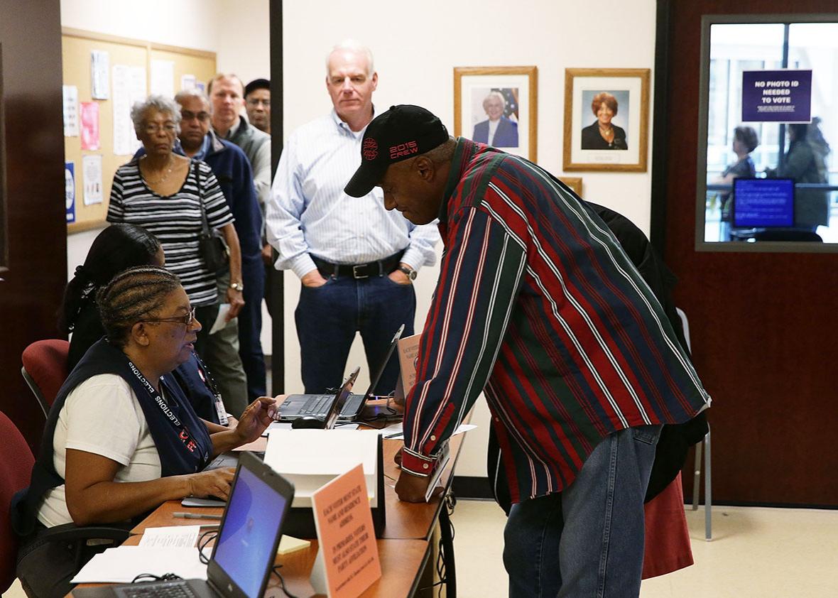 Voters wait in line for check in to cast their ballots during early voting for the 2016 general election at Forsyth County Government Center October 28, 2016 in Winston-Salem, North Carolina. 