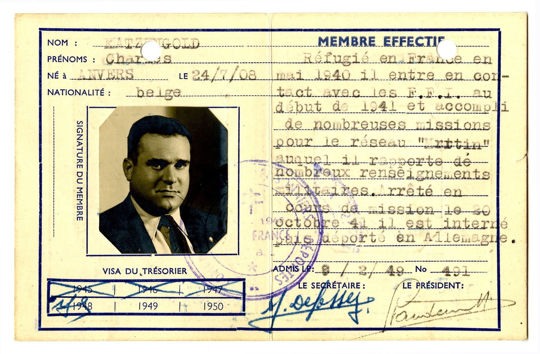 A card with French writing, and a photo of a middle-aged man. 